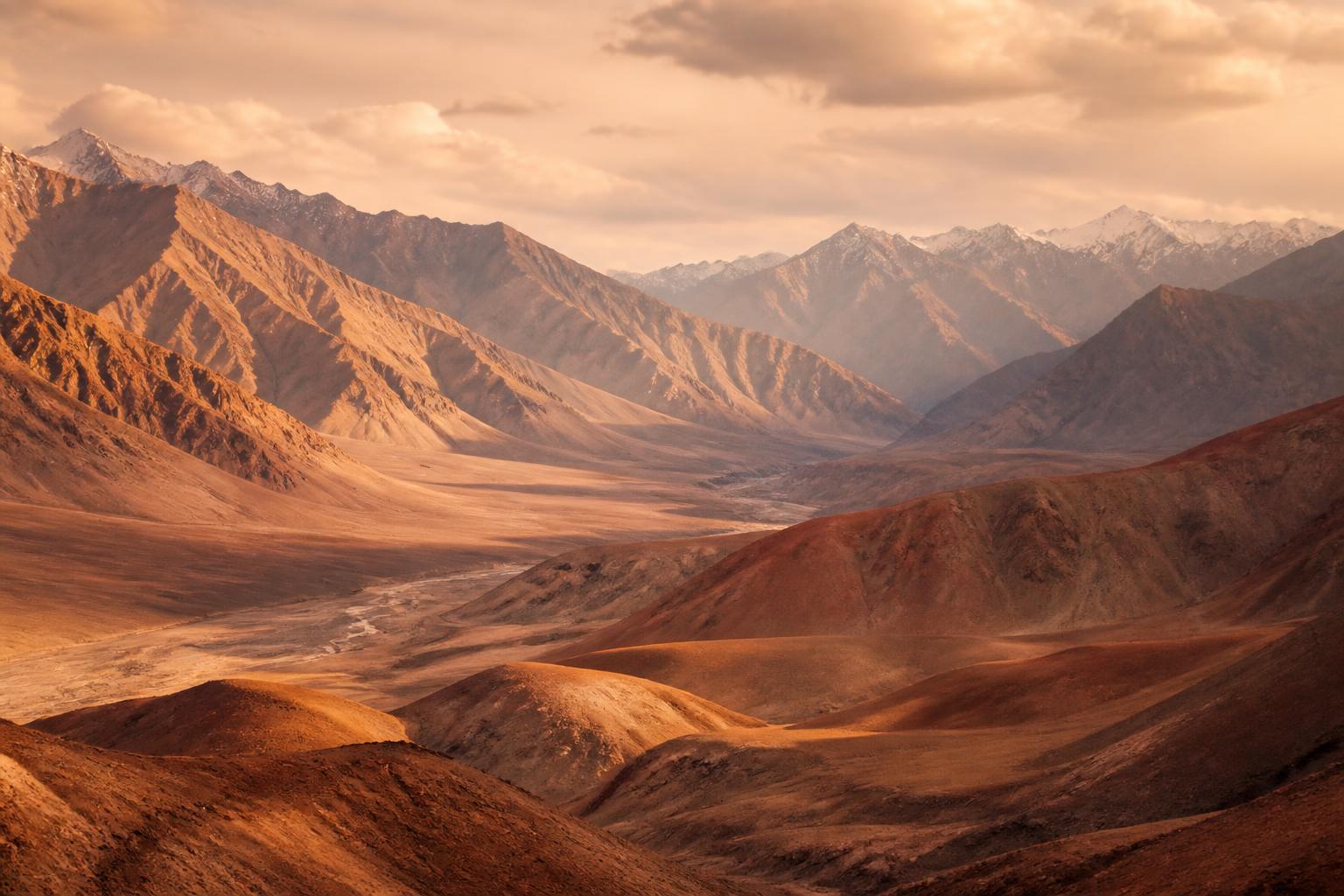 Mountain landscape in Ladakh, India, with a winding path leading toward distant peaks